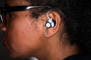ER15 custom earplug, black/white swirl, shown in ear with cable